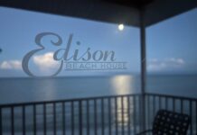 Fort Myers Beach = Pirate Ships, Pelicans, and Parasailers Moon setting over the Gulf of Mexico behind the Edison Beach House