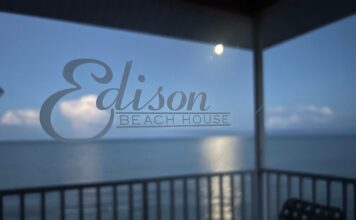 Fort Myers Beach = Pirate Ships, Pelicans, and Parasailers Moon setting over the Gulf of Mexico behind the Edison Beach House