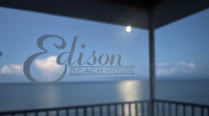 Fort Myers Beach = Pirate Ships, Pelicans, and Parasailers Moon setting over the Gulf of Mexico behind the Edison Beach House